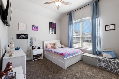 Bedroom featuring lofted ceiling, carpet, and a ce