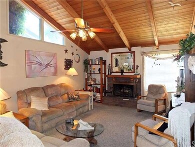 Wood Cathedral Ceiling with cozy fireplace and gre