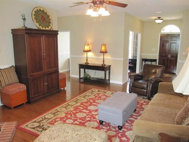 View of Fam. rm. and formal dining left of frt dr.