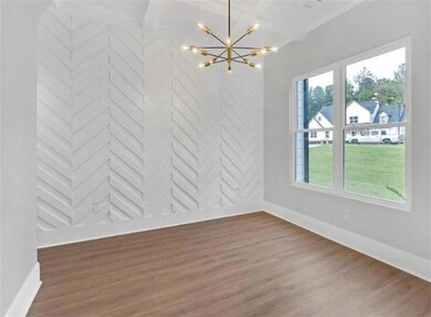 Unfurnished dining area with baseboards, a notable