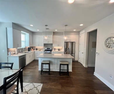 Kitchen featuring appliances with stainless steel