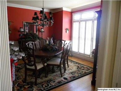 Formal dining room opens to the foyer area and the