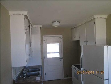 Kitchen With Stove, Refrigerator, and Washer/Dryer
