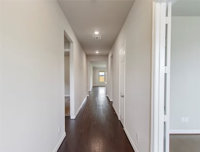 Upon entering you find a lovely corridor showcasing custom paint, beautiful wood flooring, ample lighting, leading you right into your very own, home office!
