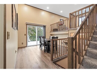 The dining room features an impressive 2-story cei