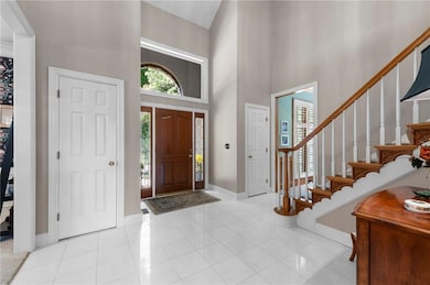 Open 2-story Entryway, wood end caps on stairs