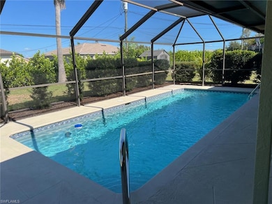 Swimming pool featuring glass enclosure, a sunroom, and a patio