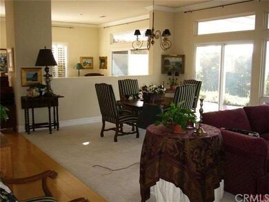 Dining area adjacent to living and kitchen with sl