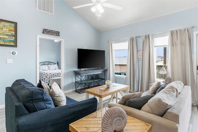 Livingroom with large picture windows lets in a ton of natural light.