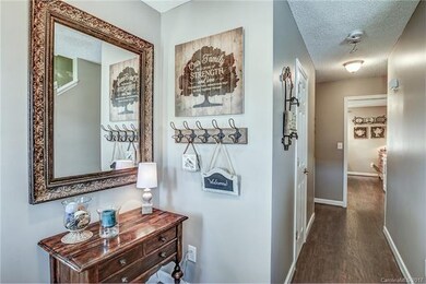 Open foyer with offset stairs and access to both k