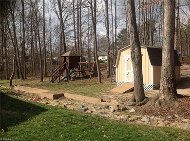 Tree house, swing set and storage building