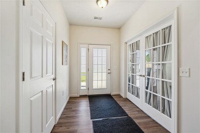 Foyer with Coat Closet and Access to Den