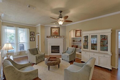 Family Room has high ceilings, natural light, built ins and corner fireplace