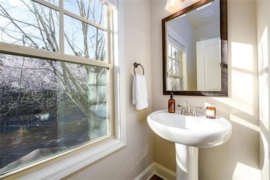 Bathroom with baseboards and a healthy amount of s