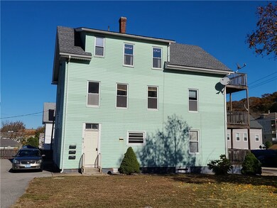 Different view of side yard and rear entry door