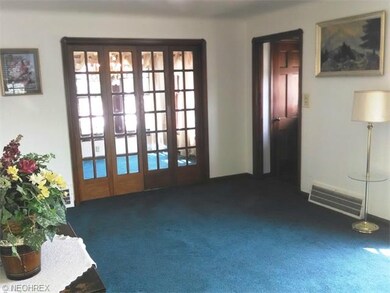 Living room, French doors to the dining room