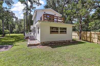 back of home with side entry to house and private 