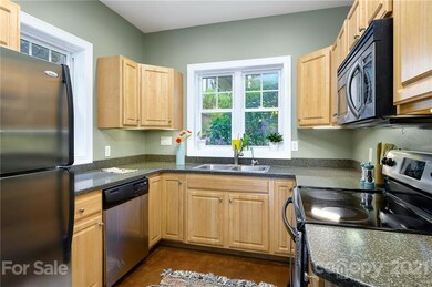 Kitchen Features Stainless Steel Appliances and Plenty of Cabinets