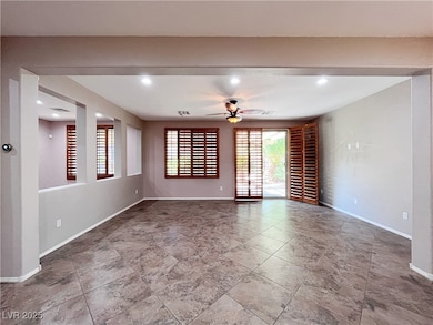 Empty room featuring ceiling fan and recessed ligh