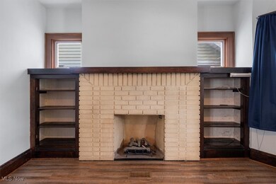 Room details featuring hardwood / wood-style flooring and a fireplace