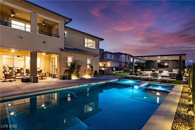 View of pool, outdoor hangout area, a ceiling fan,