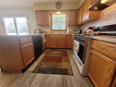 Kitchen with sink, backsplash, stove, dishwasher, 