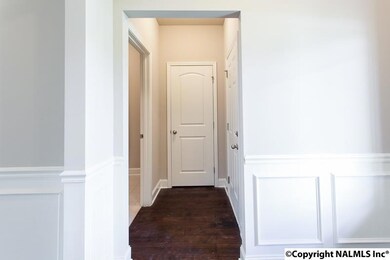 Seen from Foyer, to hall closet, laundry room and interior garage door