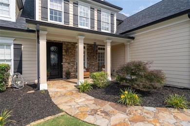 Large welcoming front porch with new metal room and the main roof is new also