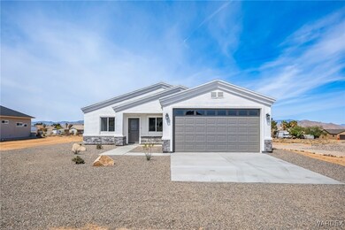 Ranch-style house with an attached garage, concret