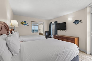 Bedroom featuring light hardwood / wood-style floo
