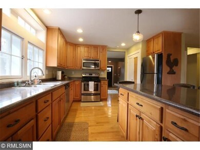 Spacious kitchen features above the sink windows, 