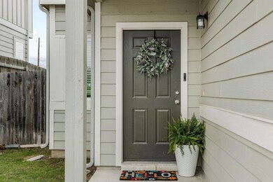 Doorway to property featuring fence