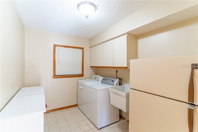 Large laundry/utility room with sink, washer/dryer