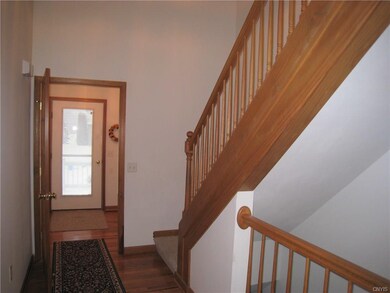 Entry foyer and hall showing stairs to second leve