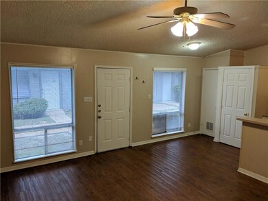 Foyer featuring a textured ceiling, a ceiling fan