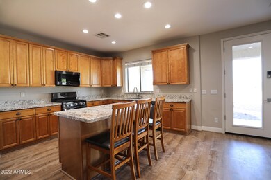 Kitchen with granite counters and island
