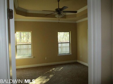 Tray ceiling, crown moulding, view to privacy fenc