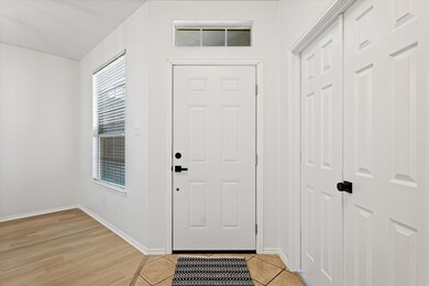 Entrance foyer with light tile patterned floors