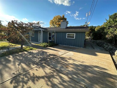 Huge driveway in front and an even larger one in b