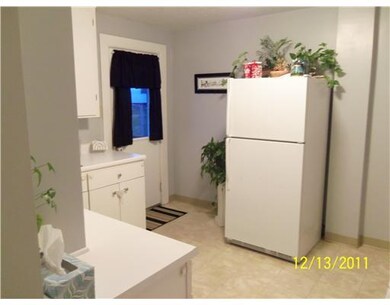Kitchen. A rear exit door leads to covered porch, 