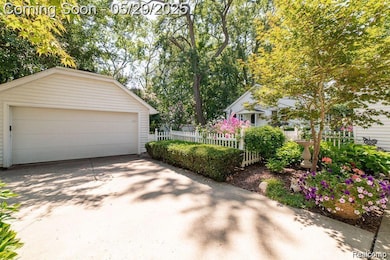 Nestled on .38 acre lot w/ English Garden touches