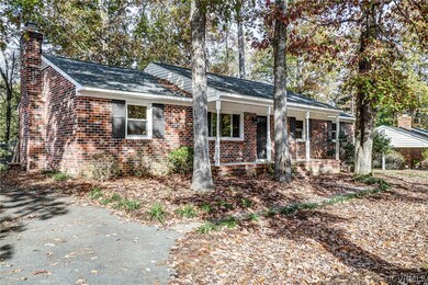 Huge, double-width paved driveway. Concrete sidewa