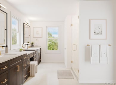 Full bath featuring double vanity, a stall shower, and light tile patterned floors