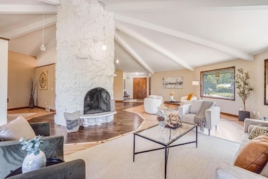 Great room w/ vaulted ceilings, custom HW floors