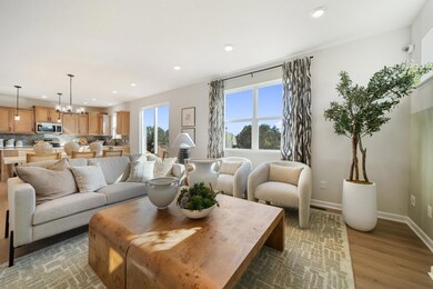 The living room opens into the dining room and kitchen.