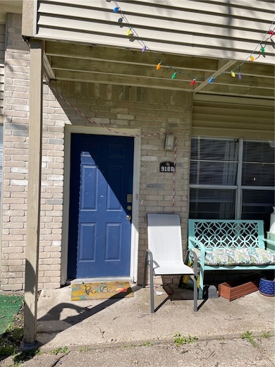 Doorway to property with brick siding