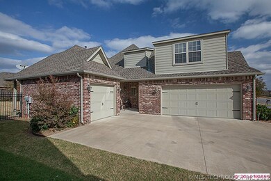 Three car garage. Small patio at side off of utili