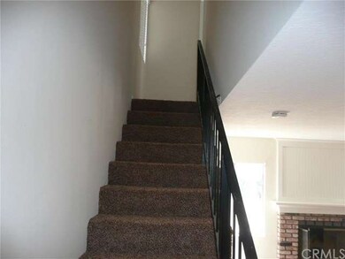 Stairway to private master suite and bath