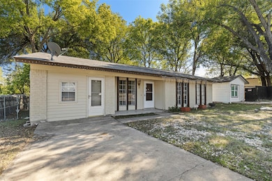View of front of property with brick siding, a sh