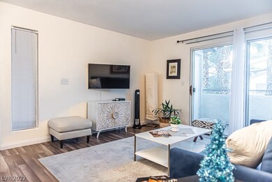 Living/family room with a balcony and a view of th